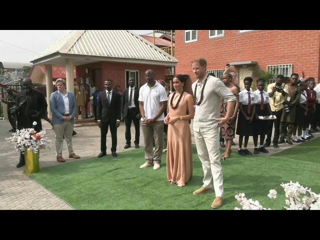 Prince Harry and Meghan arrive in Nigeria on unofficial visit | AFP class=