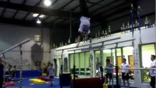 Back half off of parallel bars/ Arnold dismount