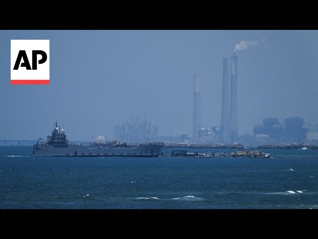 Palestinians in central Gaza wait for aid trucks to roll off pier built by US