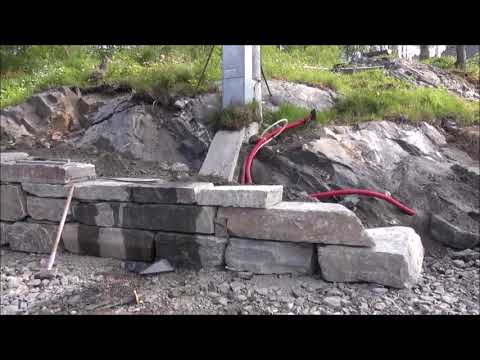 Video: Hvordan bygger du en steinmur med en rund stein?
