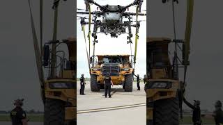 Giant Drone Lifts A Yellow Truck