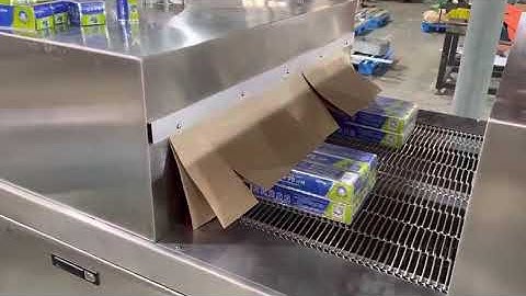 Cuff type heat shrinkable machine for packing toothpaste