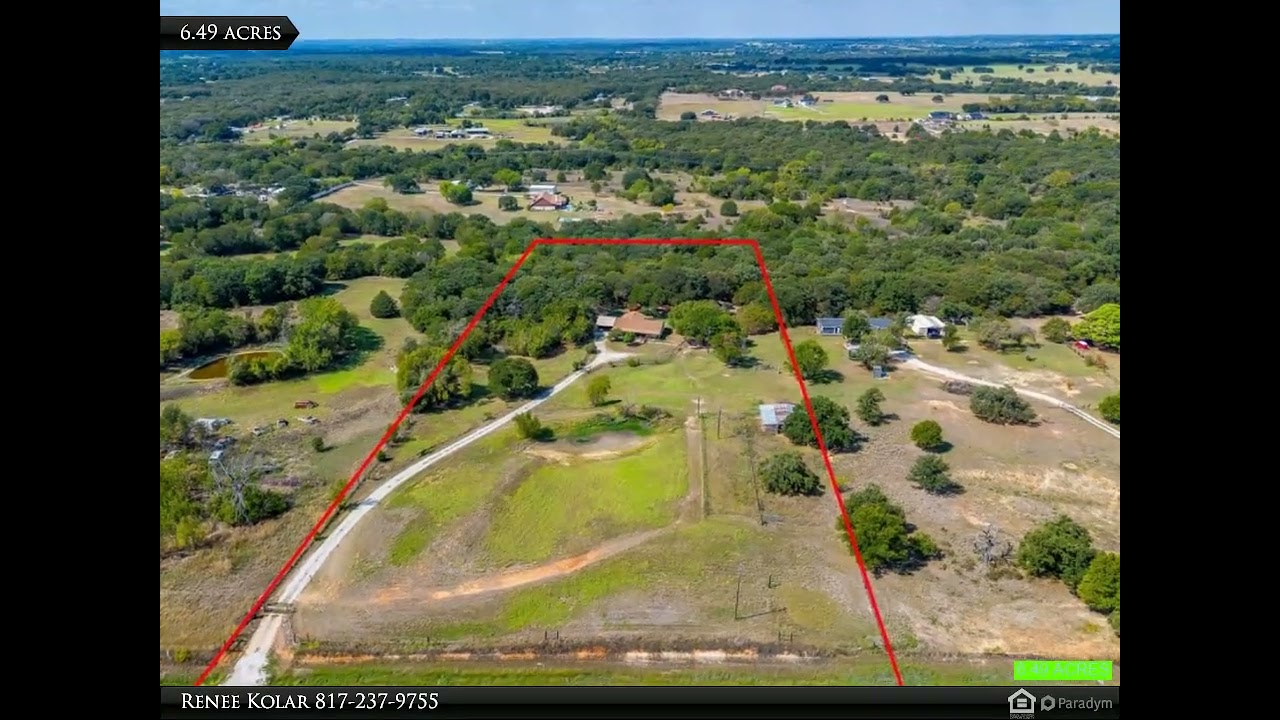 Charming country home with huge covered front porch, and charming wood bridge. 6.49 ac