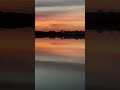 A Lake Mirrors a Sunset