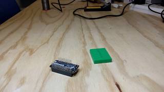 Soldering stacking headers onto the Adafruit ESP32 Feather