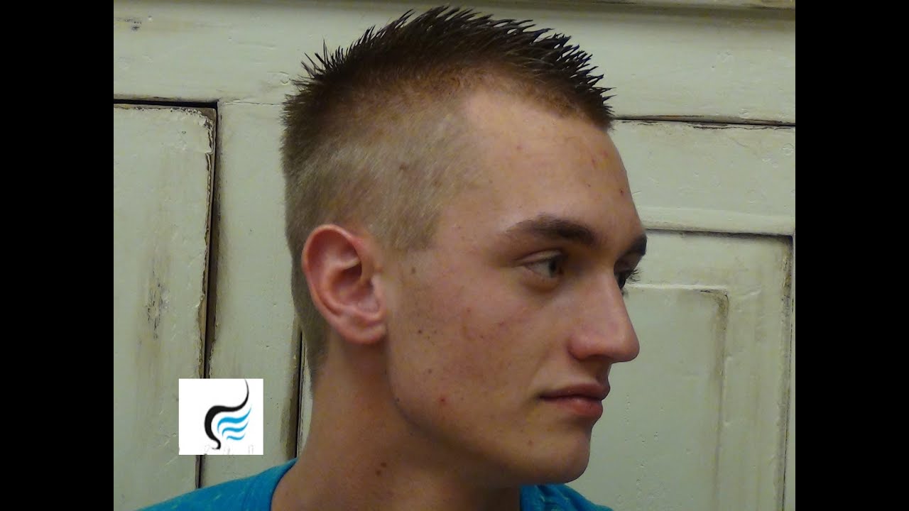 12 year old boy showcasing a long rat-tail hairstyle