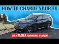 How To Charge Your EV On A Tesla Charging Station