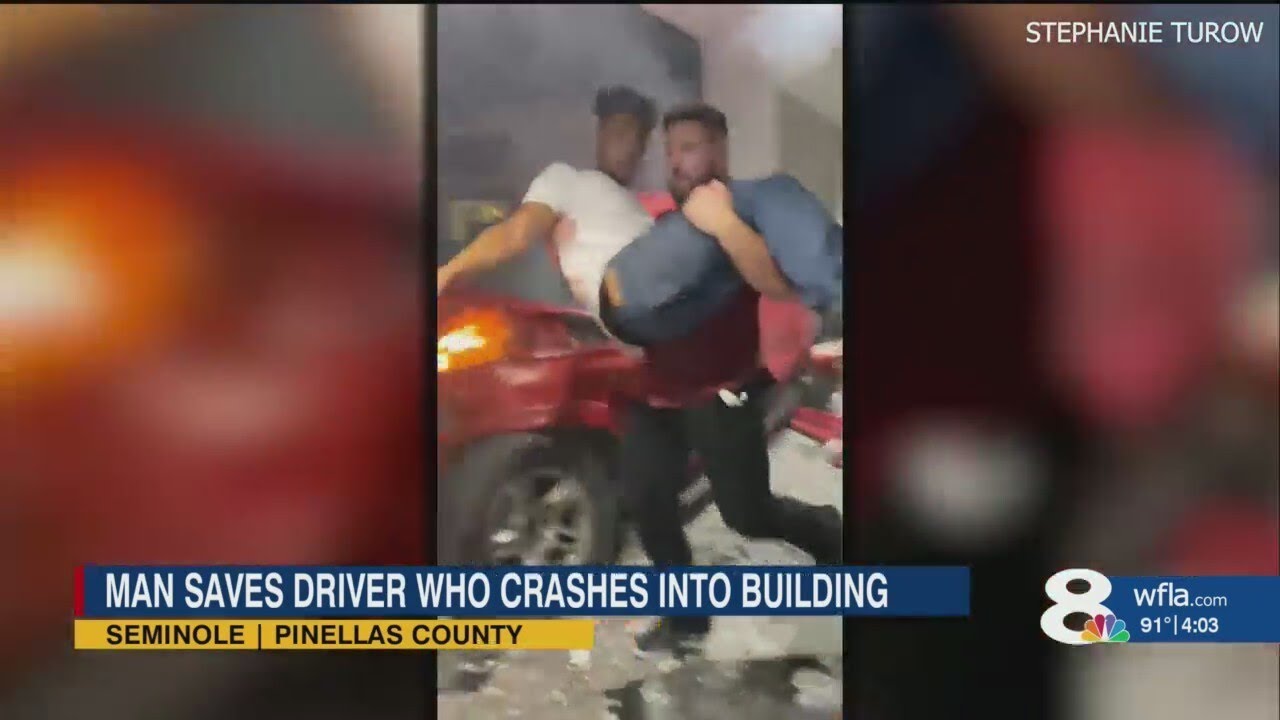 VIDEO: Good Samaritan rescues man trapped in burning car after crash in ...