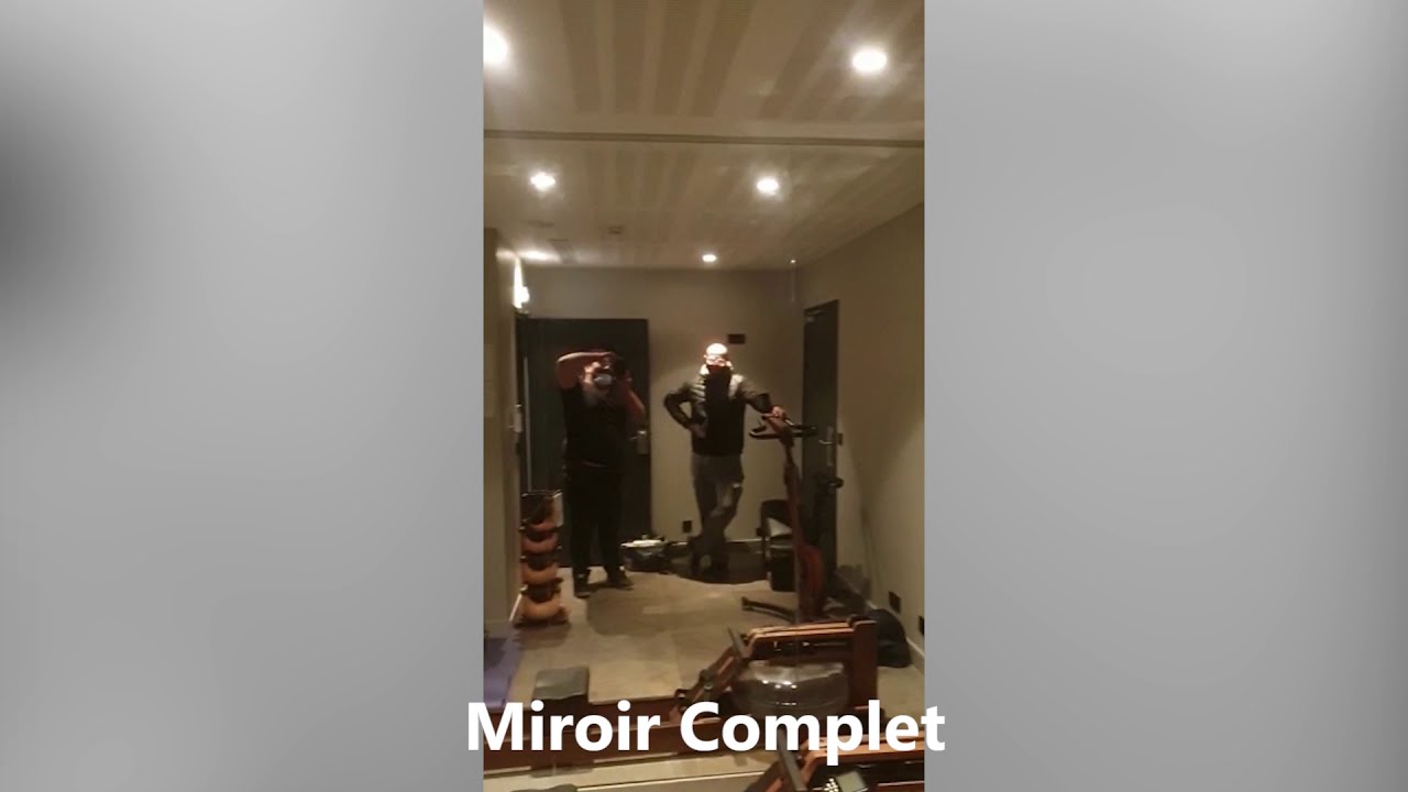 Vitrier Paris Expert : Installation d'un miroir sur tout un mur