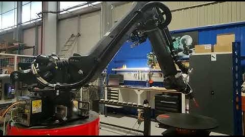 Robot machining tool changer on the rack station with KUKA KR210 Krc4