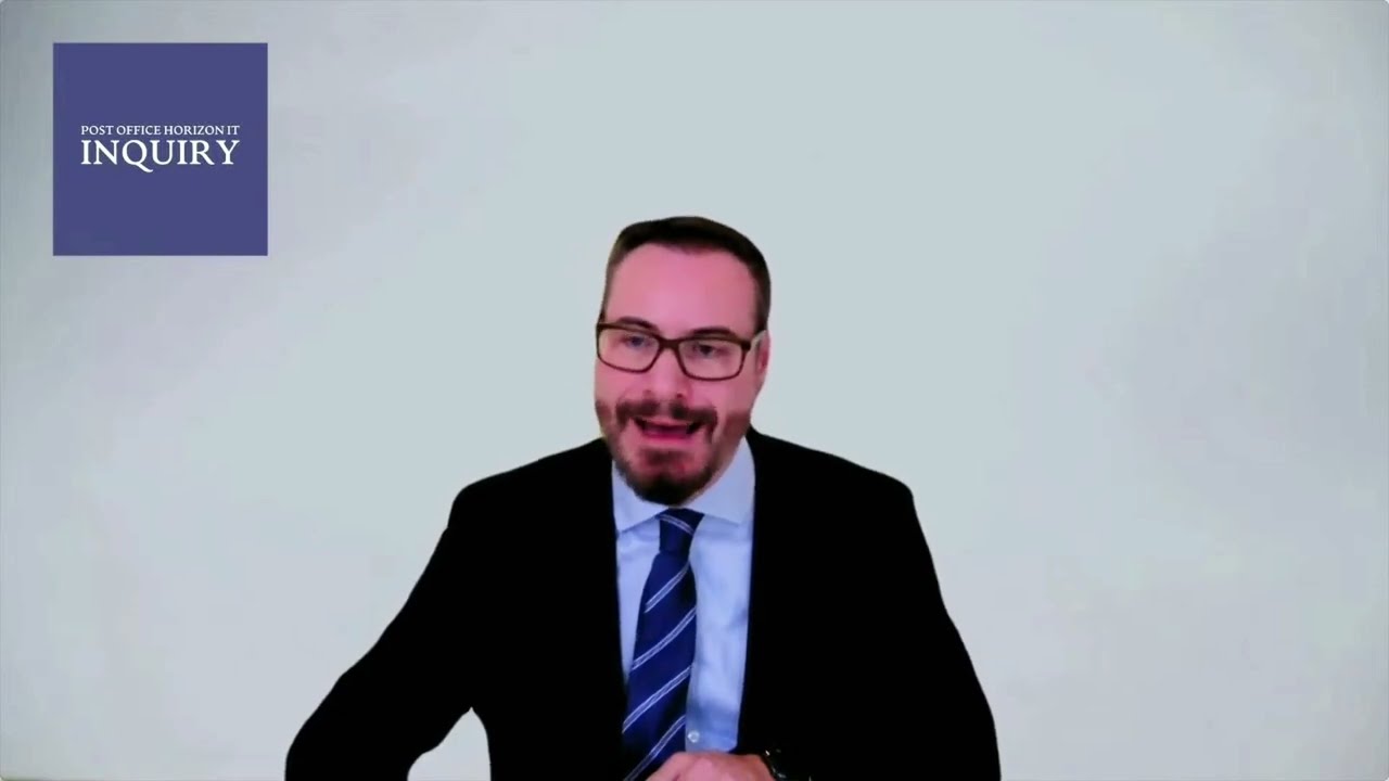 Ben Foat is answering questions at the Post Office Inquiry and keeps flashing his pearly whites