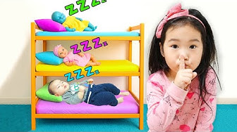 Baolan takes care of her brother and her toy baby thumbnail