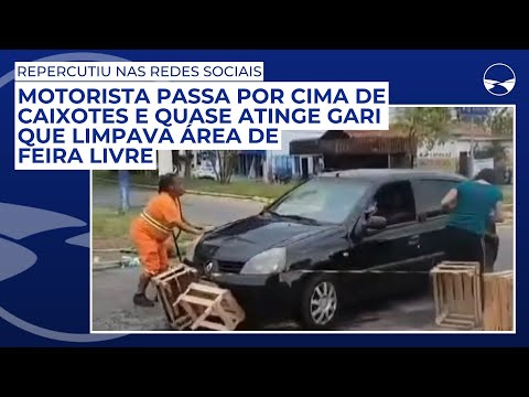 Motorista passa por cima de caixotes e quase atinge gari que limpava área de feira livre