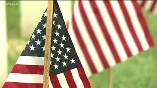 Scouts place flags at Marietta National Cemetery