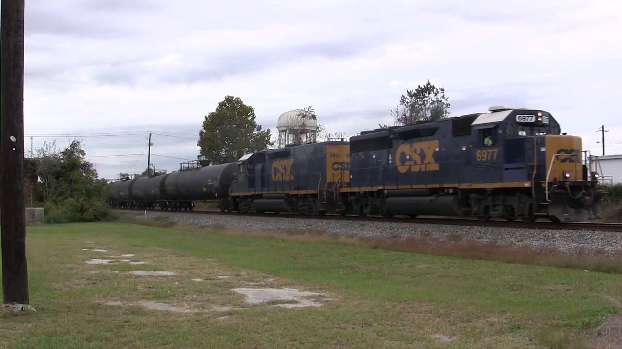 CSX GP40-2 6977 leads CSX A783-30 through downtown Valdosta, GA