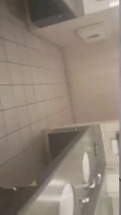 man caught watching porn in airport bathroom