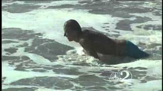 Surfers Enjoy Big Waves At Coast