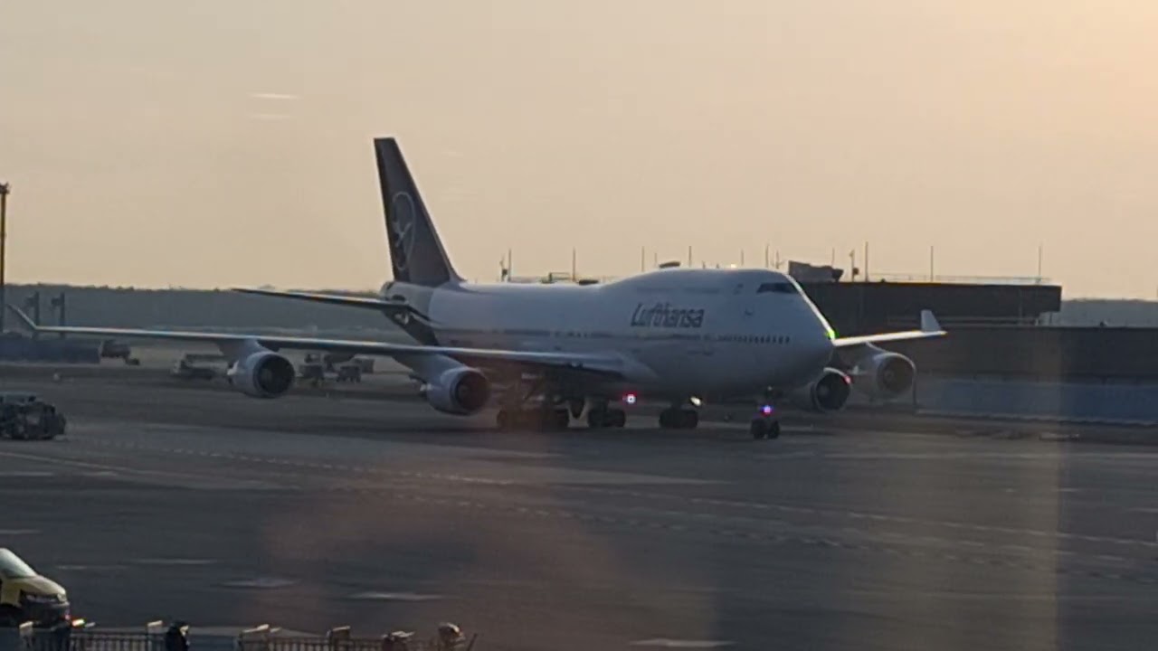 LH761 from Dehli D-ABVU B747-400 roll in at the gate on sunrise in the morning frankfurt airport 