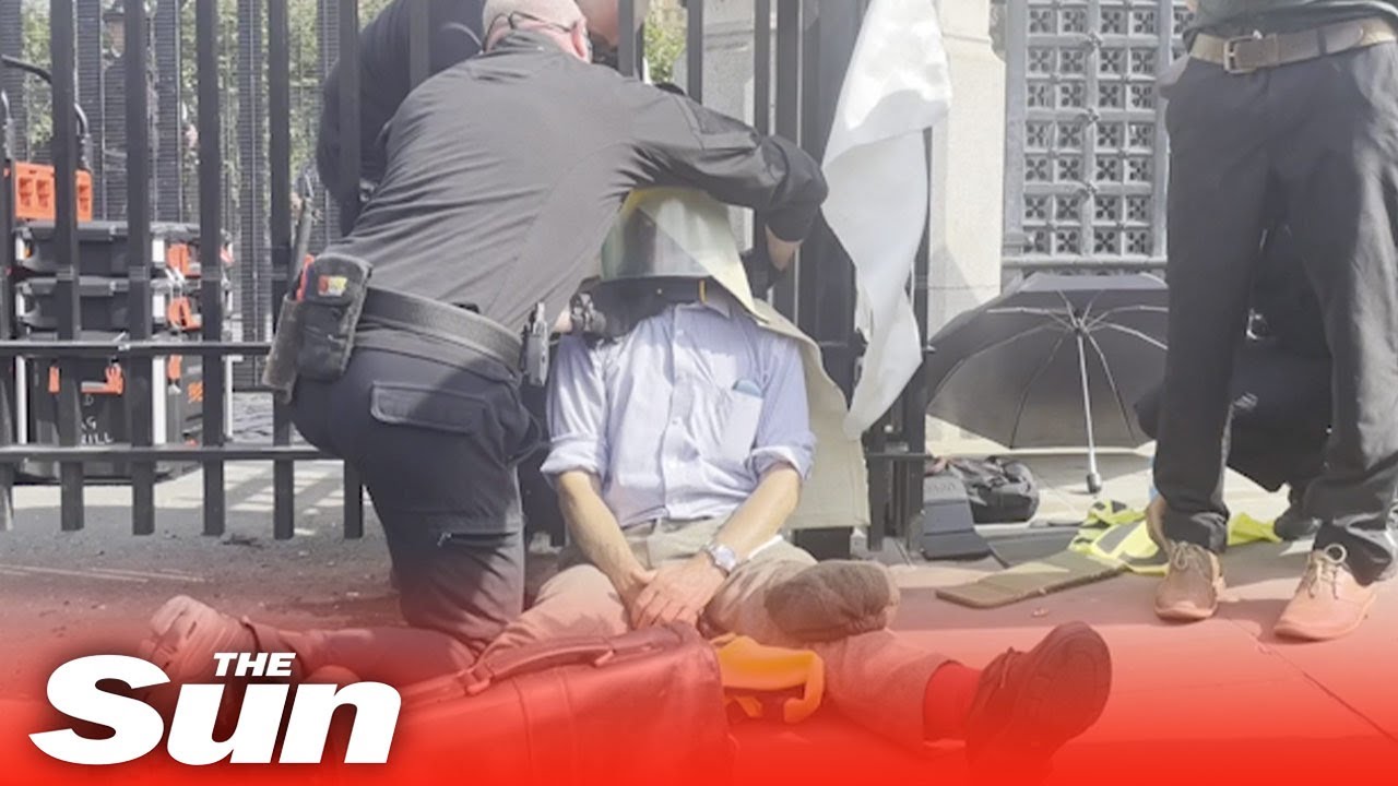 Extinction Rebellion activist chained to Commons gates removed by chainsaws