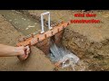 mini dam construction [ with bricks ]