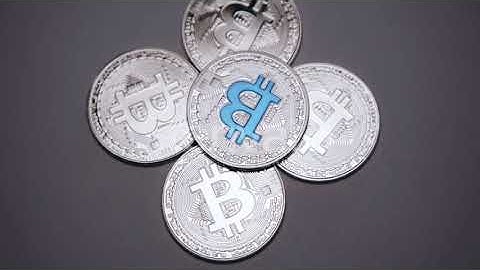 Cryptocurrency, Silver Bitcoins Rotating on the Grey Background   - Stock Footage 2018  [Video Hive]