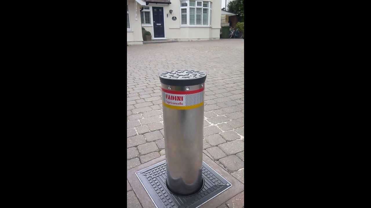 Using an automatic rising bollard for a driveway via a handheld remote