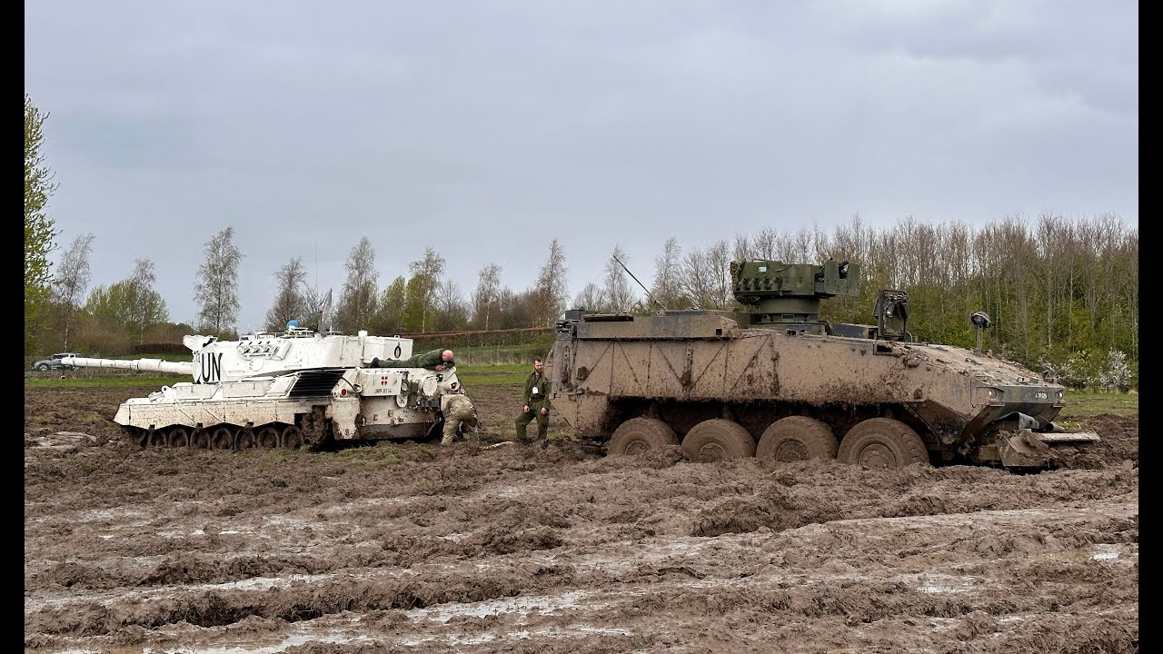 Leopard 1A5 on recovery mission - Piranha 5 stuck in deep mud