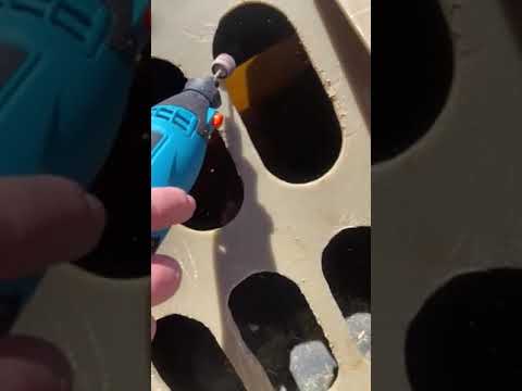 Using a Dremel with a sanding attachment to smooth grate edges