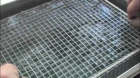 Ultrasonic cleaning of glass slides and vacuum jigs