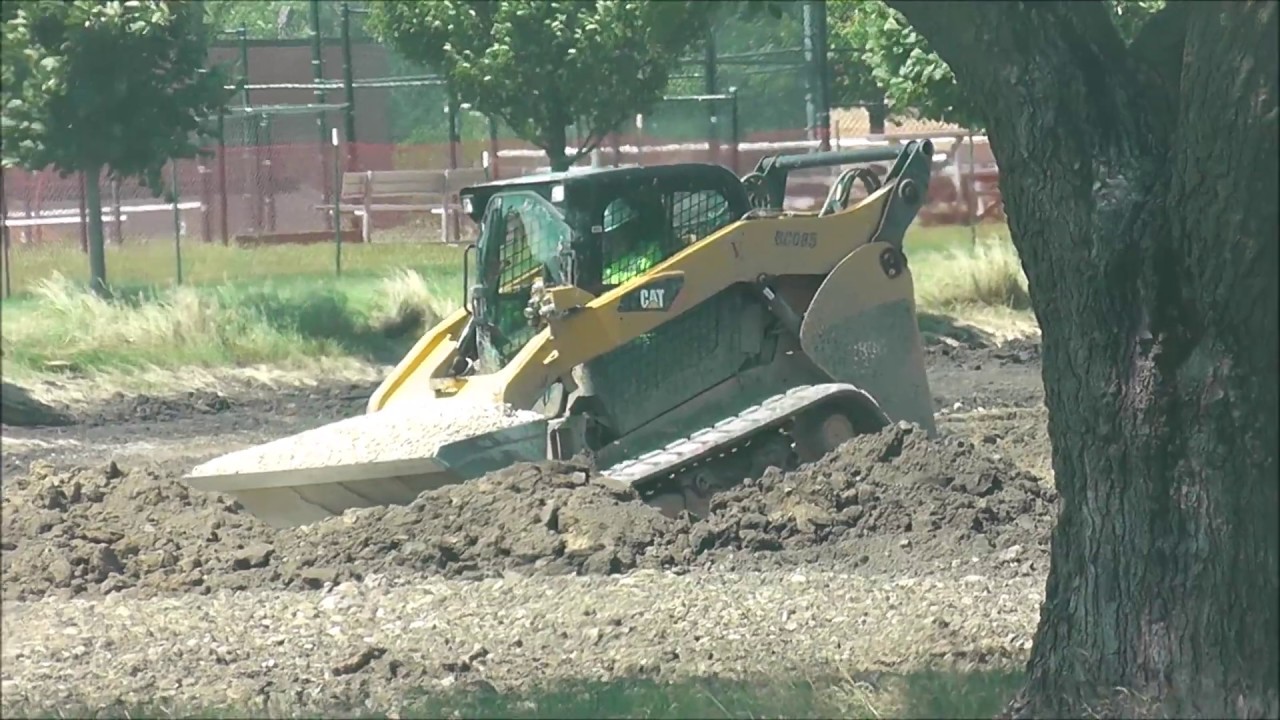 CAT Skid Steer Moving Gravel