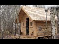 stove and window to my traditional log cabin with hand tools , rain and wild animals