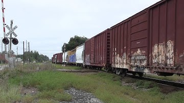 CSX A783-24 with CSX GP40-2 6048 and Norfolk Southern G-64 with NS SD4- 2 6077 leading