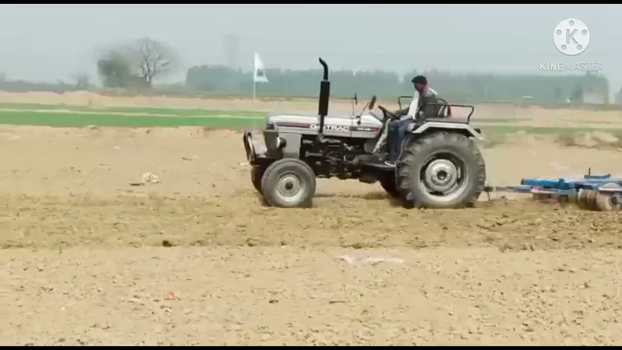 Digitrac PP 46i Tractor. Digitrac PP 46i with Harrow Cultivator and Trolley.