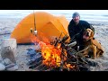 Solo winter tent camping on a lake superior beach surf fishing