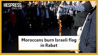 Moroccans burn Israeli flag during march in support for Gaza in Rabat