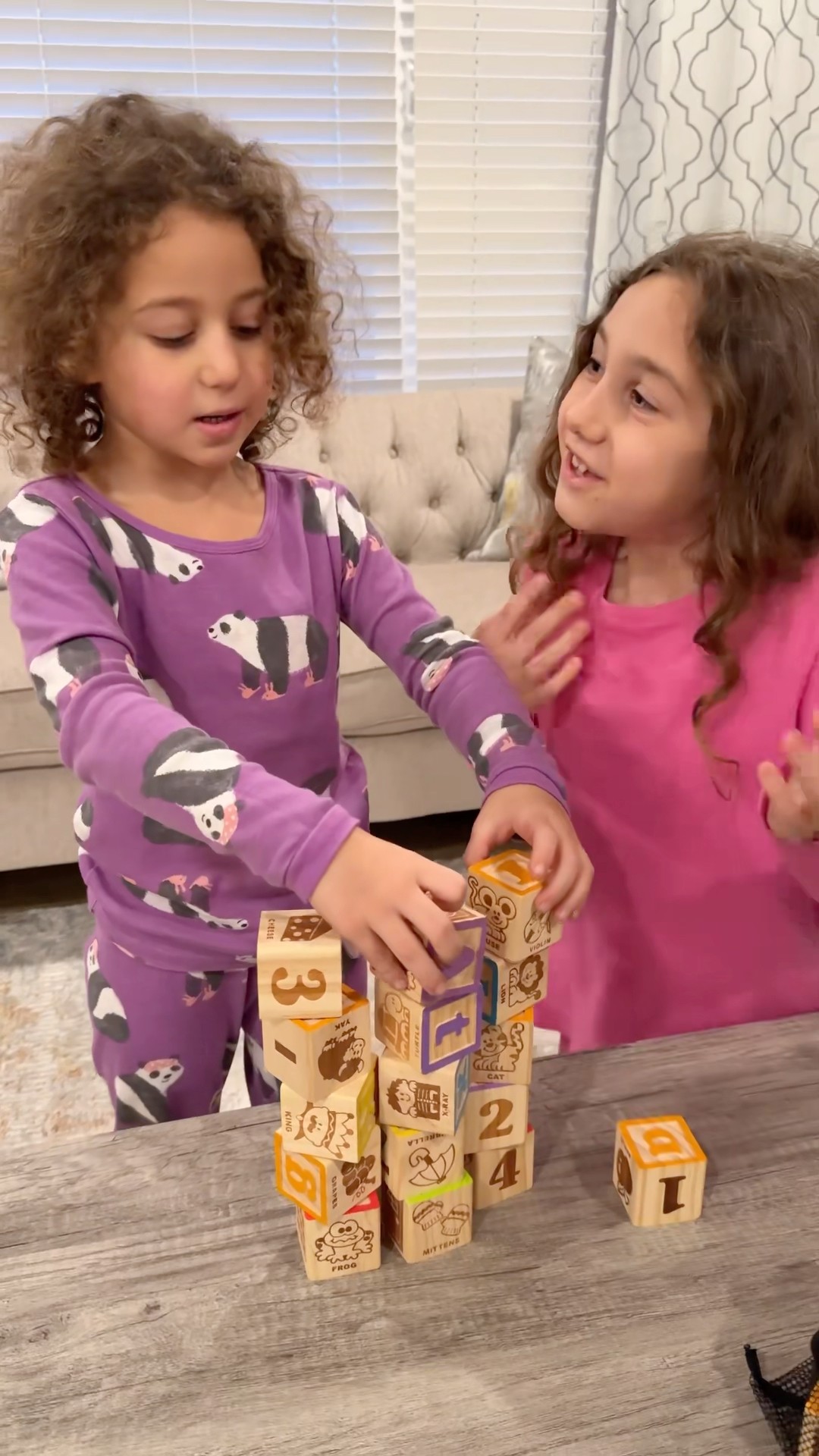 Sierra teaches Rhia good ways to learn letters, numbers and items