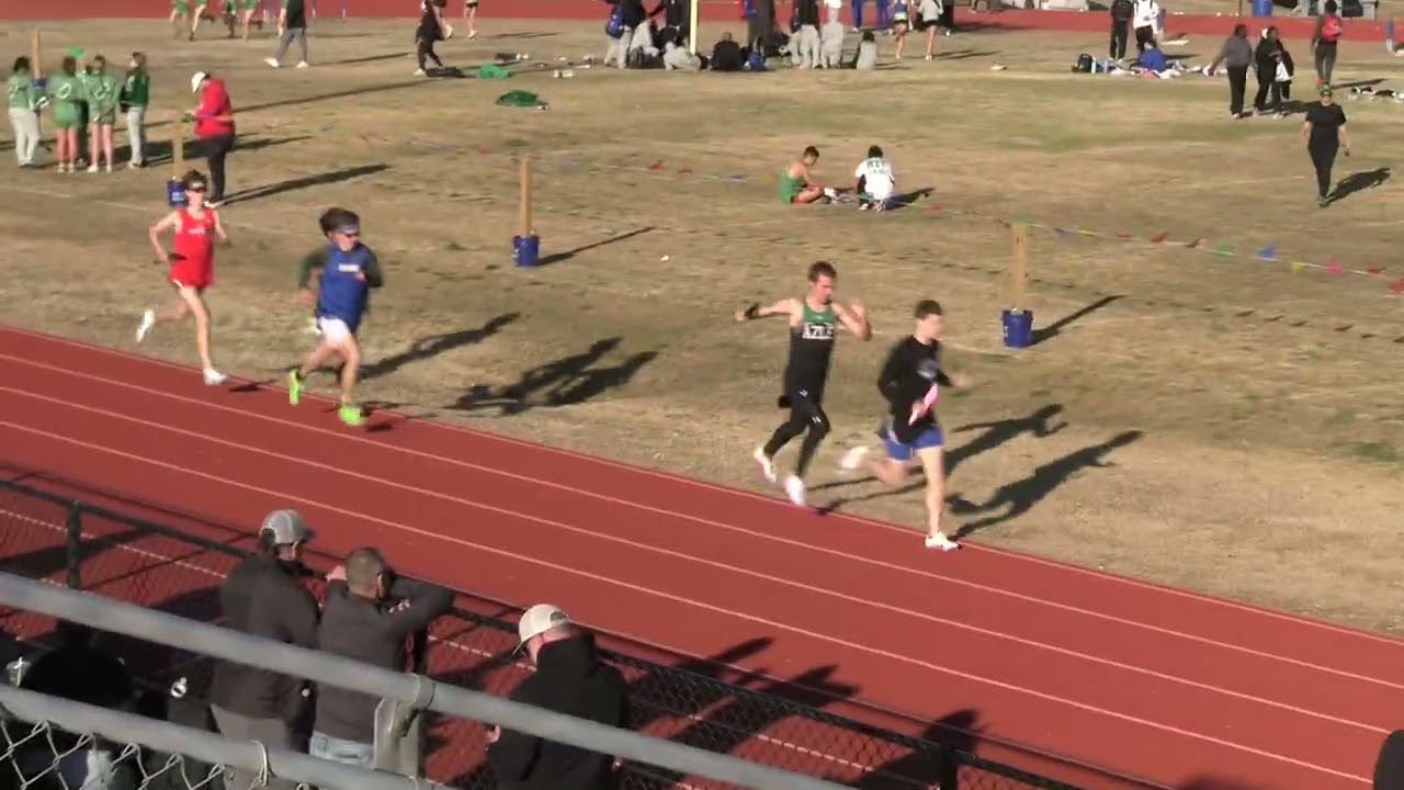 Jake Mooney of Midlothian Heritage leads the 4X800 from 7th to 2nd  at the (windy) Decatur Relays