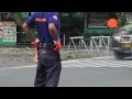 Dancing traffic enforcer moves and shakes to the beat
