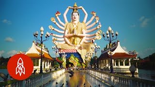 Tour This Tranquil Buddhist Island Temple of Giant Statues