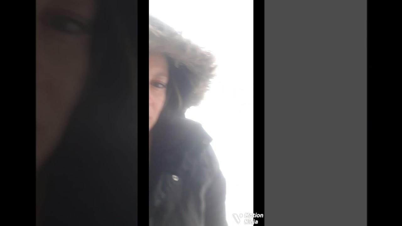 smoking outside and crushing a cigarette in the snow 