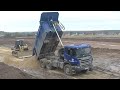 Scania P440 6x6 KH-Kipper working in the mud part 1