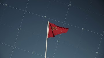 FLAG OF MOROCCO WAVING IN WIND ON BEAUTIFUL SUMMER DAY WITH BLUE SKY