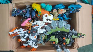 Box full of Various Dinosaurs and robot dinosaurs, velociraptor, T rex, triceratop, Jurassic world11