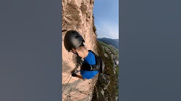 Ascending a smooth wall on a fixed rope route - 360 camera live action