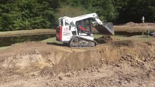 Bobcat T590 building jumps at the motocross track