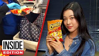 Why Is This Woman Carrying So Many Bags of Cheetos?