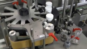 HERMA 132M HC - Wrap-around labelling machine for vials, bottles and containers