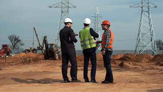 Engineers Talking in Front of the Electrical Towers | Free Stock | Royalty Free Video | No Copyright
