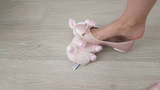 Crushing soft teddy bear with ballet shoes