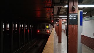 R46 #5768/#6146 (Q) via Whitehall w/ Orange (Q) signage leaving Canal Street